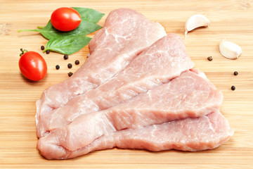 Raw pork with spices and vegetables