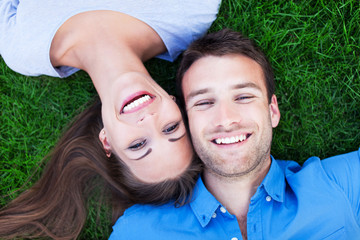 Couple lying on grass