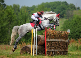 Three day event rider taking part in the cross country Phase