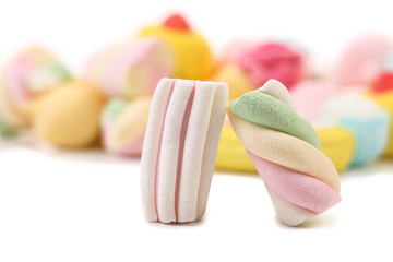 Two colourful marshmallow on background of other.