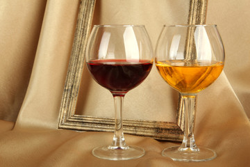 composition of frame and wine on bright background