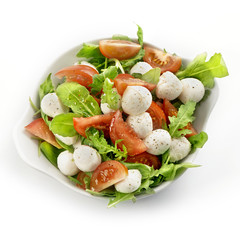 healthy fresh rucola salad with mozarella and tomato slices