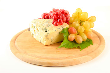 Tasty blue cheese and grape on cutting board, isolated on white