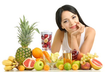 Girl with fresh fruits isolated on white