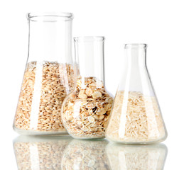 Groats in test tube isolated on white