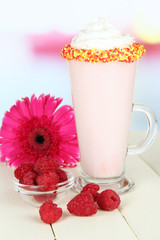 Delicious milk shake on table on light background