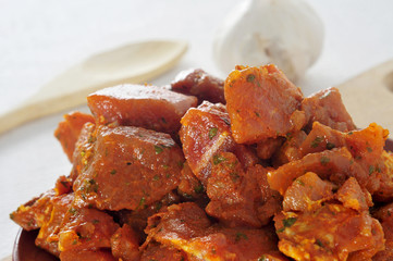 spanish raw pinchos meat, marinated pork meat for cooking in ske