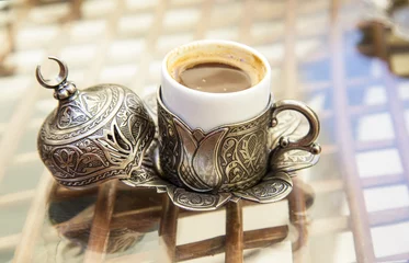 Fototapeten traditional turkish coffee on a glass table © berna_namoglu