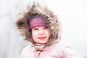 A Toddler Braves The Cold and Snow