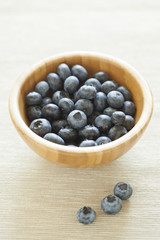 organic blueberries in a wooden bowl