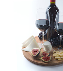 Two glasses of red wine, goat cheese and fig