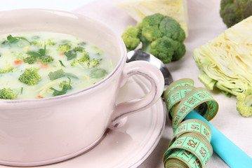 Cabbage soup in plate on napkin close-up