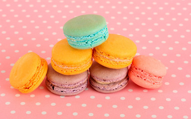 Gentle macaroons on pink background