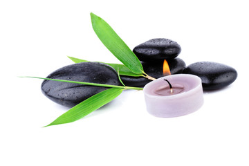 Fototapeta premium bamboo leaf and zen pebbles over white