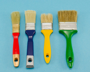 hand paint brush color different size on blue