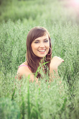 beautiful brunette in a field