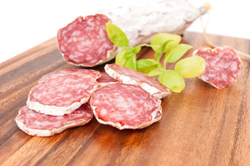 sliced salami on white background