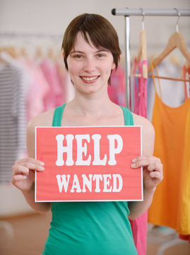 Job offer: Woman with Help Wanted sign