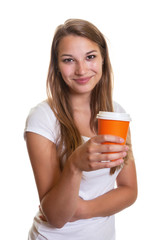 Young girl presenting a cup of coffee