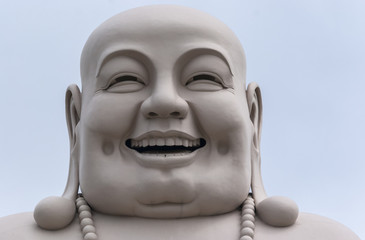 Head of Massive White Buddha isolated from decor.