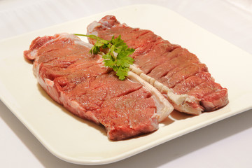 beef steak raw entrecot with parsley