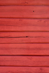 Red painted, hand carved old log wall, texture material.
