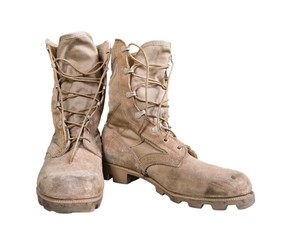 Old combat boots isolated over white