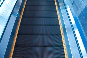 Moving escalator in an airport