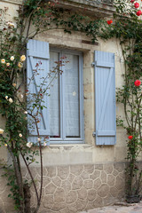 The romantic window with red roses