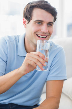 Cheerful Man Holding A Glass Of Water