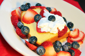 Cake with berries and whipped topping
