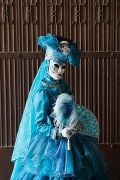 The blue lady in the carnivalesque costume  and venetian mask
