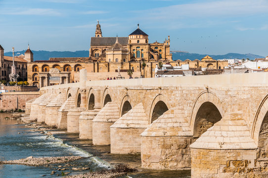 View of Great Mosque of Cordoba across famous Roman Bridge.