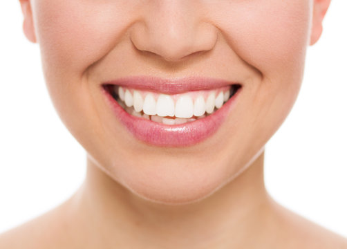 Dental care woman. Female with white teeth smiling, isolated