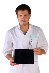 doctor holds pad in front of him