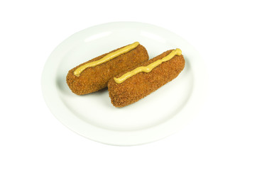 Plate with two beef croquettes with mustard.