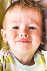 Plaintive portrait of cute little boy