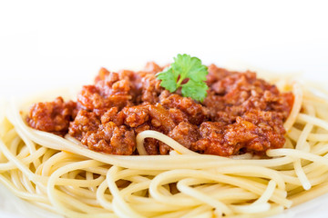 Spaghetti bolognese decorated with coriander leaf