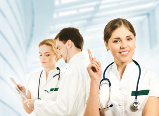 Fototapeta premium A team of young and smart medical workers in white clothes