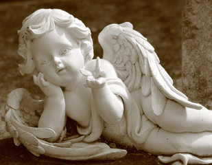 little angel with butterfly, statue in sepia