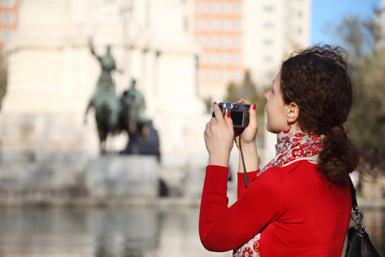 Woman photographs monument to Don Quixote