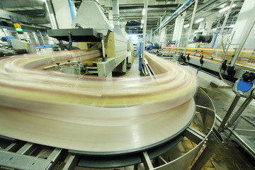 Bottles go on conveyor in factory