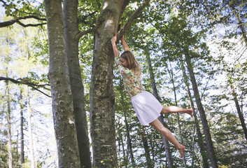 Girl climbing a tree