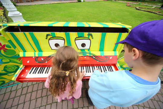 Children play piano