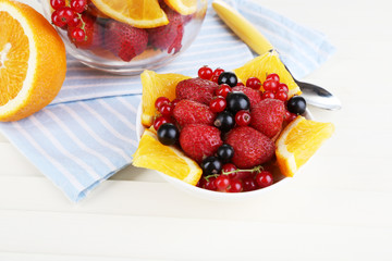 Useful fruit salad in glass cup and bowl