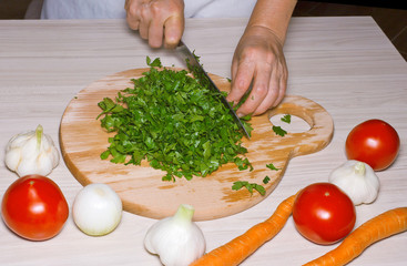 Cutting parsley in a kitchen.