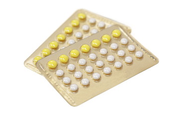 birth control pills in white background