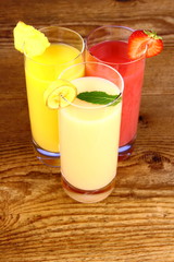 Banana, strawberry and pineapple juice in glass