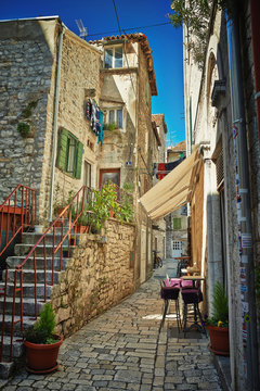 Fototapeta Traditional old street of Croatia with cafe