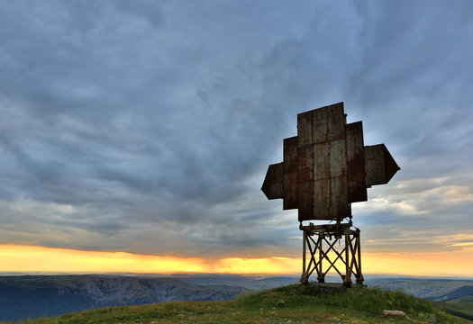 old radio antenna in mountains